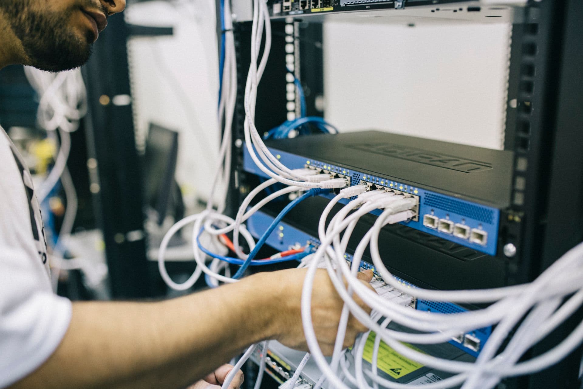 Fluke DSX-8000 copper and fiber cable certification testing at a patch panel on a Utah commercial project
